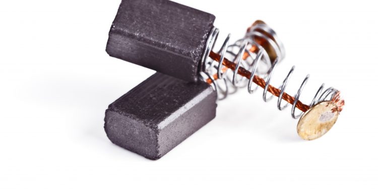 The electro-conductive graphite brushes electric current to the collector of the motor on a white background