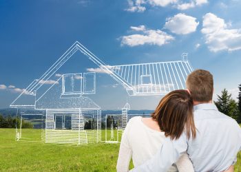 Loving young couple looking at dream house.