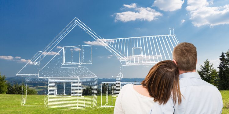 Loving young couple looking at dream house.
