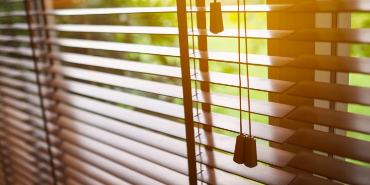 Wooden blinds with sun light.