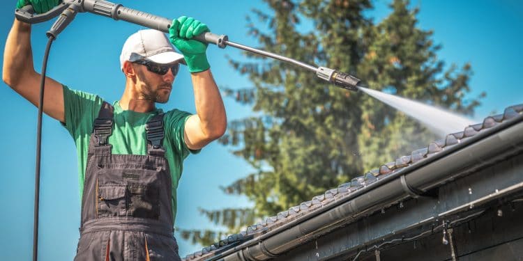 Washing Plastic Transparent Carport Roof by Caucasian Men. Pressure Washer Job.