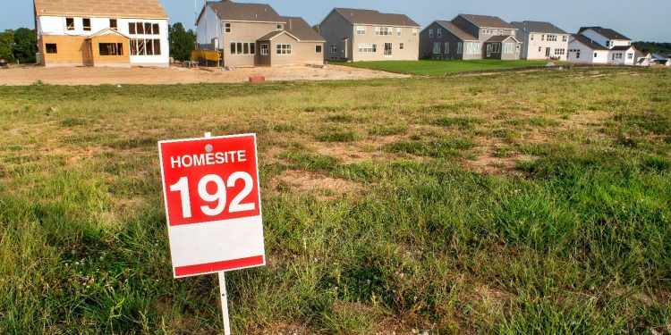 A sign in a field Description automatically generated with medium confidence