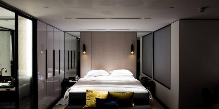 Bed With White Bed Sheet and Pillowcase Set