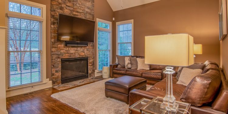 Brown Leather Couch Beside Brown Wooden Table