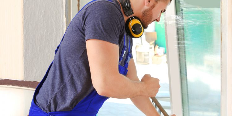 Worker repairing window in flat
